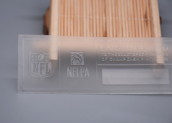 Logo silikon mengkilap pencetakan TPU transparan yang dapat disesuaikan untuk pakaian